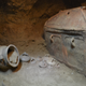 One of two coffins found in the tomb, amid bits of pottery.